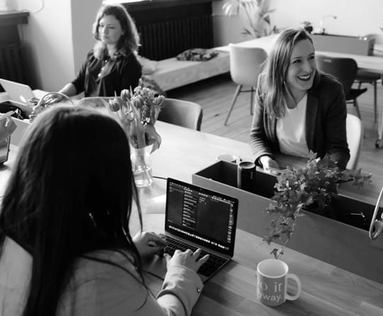 3 people sitting at a table